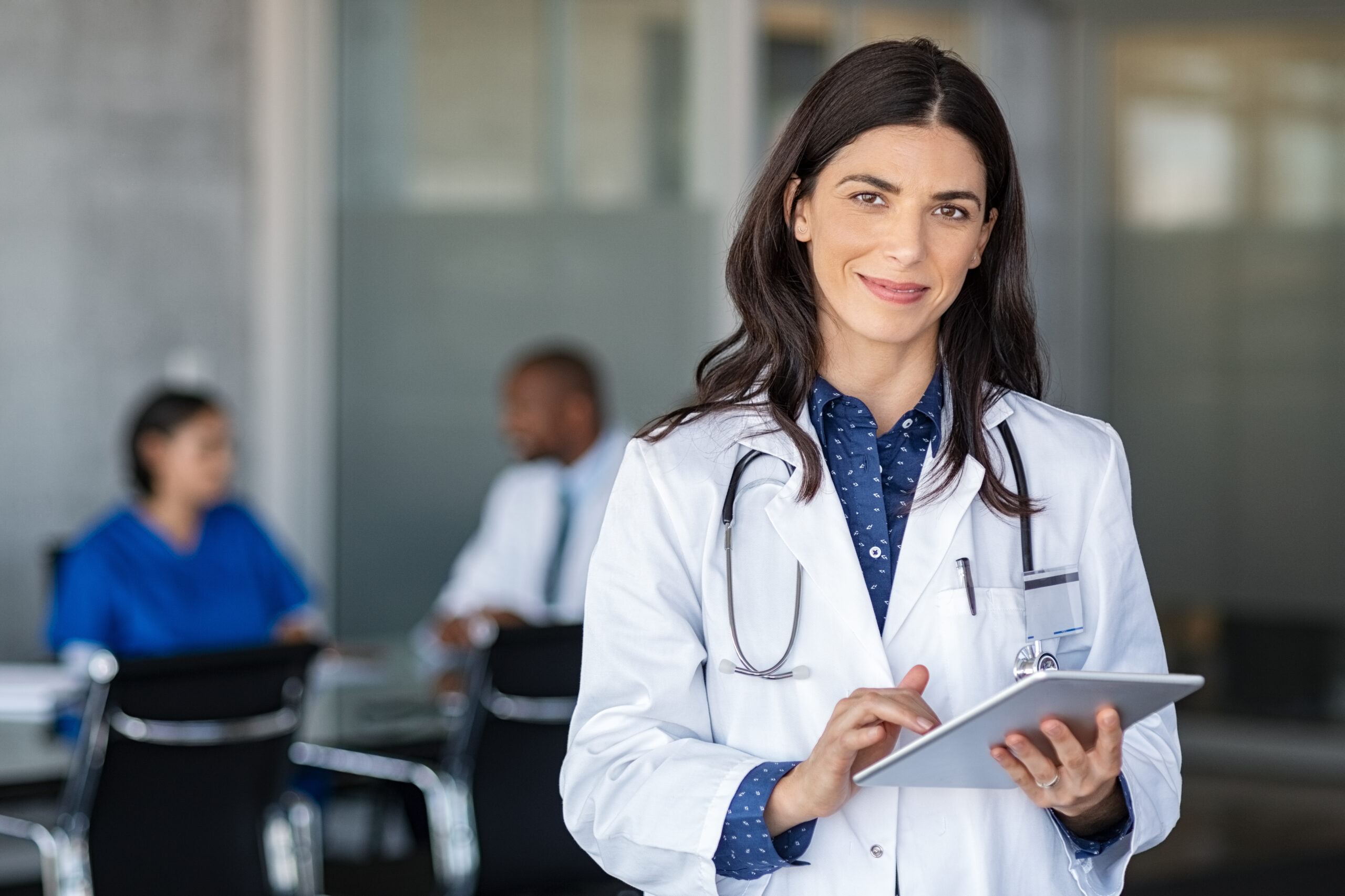 Doctor holding digital tablet at meeting room Doctor holding digital tablet at meeting room